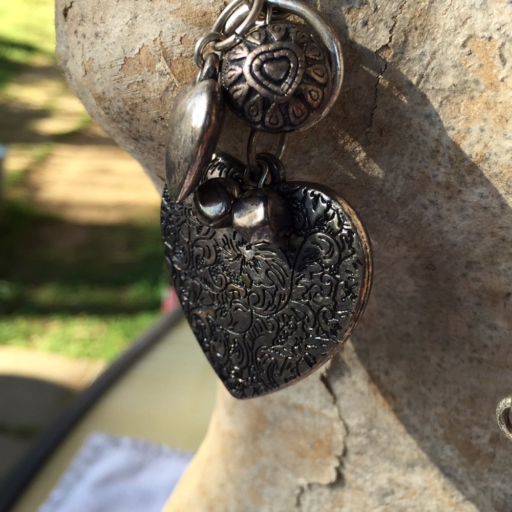 Silvertone bangles on a chain necklace